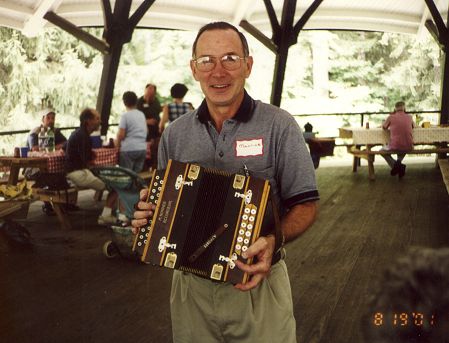 Maurice Kaiser holds the accordian
